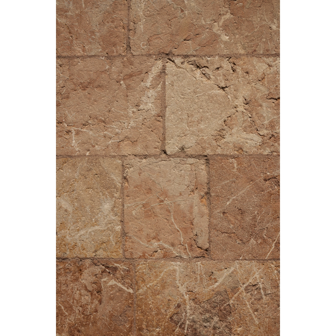 Fondo de piedra en tonos tierra con piezas rectangulares y textura mineral tipo pared